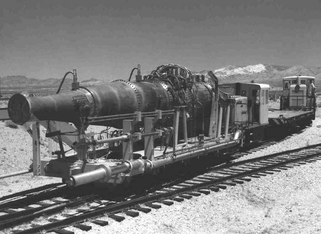 The Tory II-C nuclear ramjet reactor mounted on a flatcar at a desert test site.