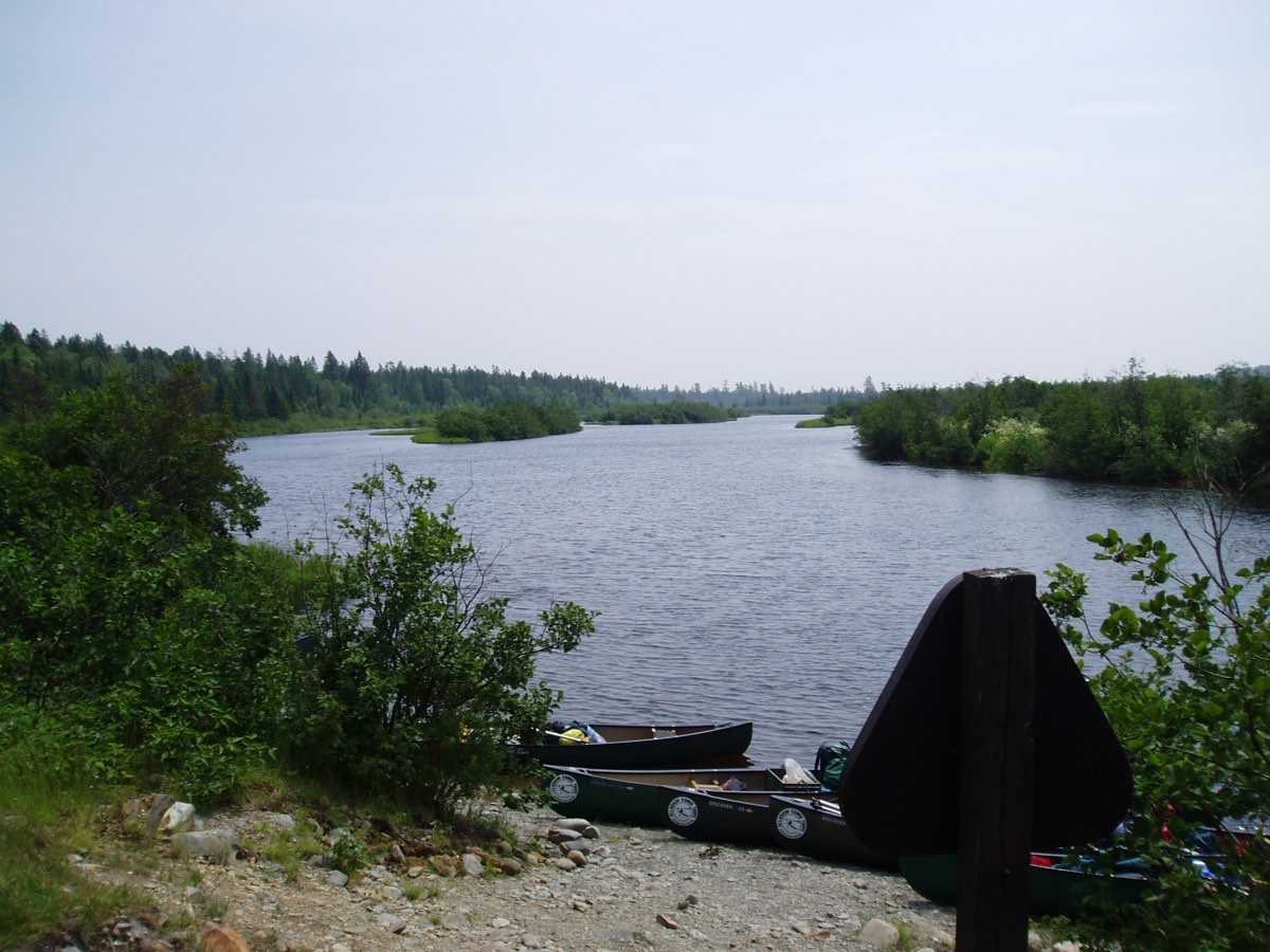 The Allagash River running between forested banks in northern Maine.