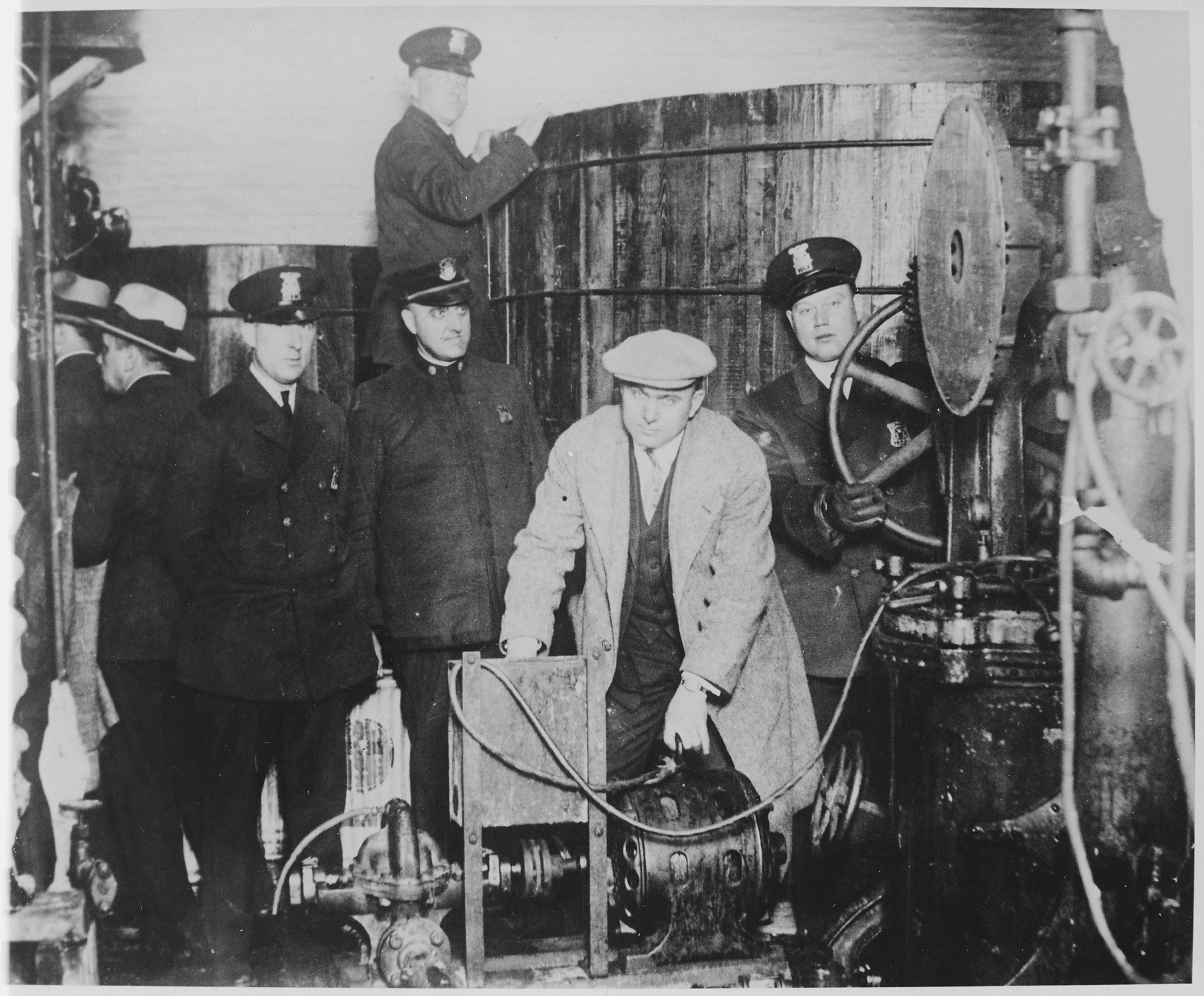 Detroit police inspecting a clandestine underground brewery during Prohibition